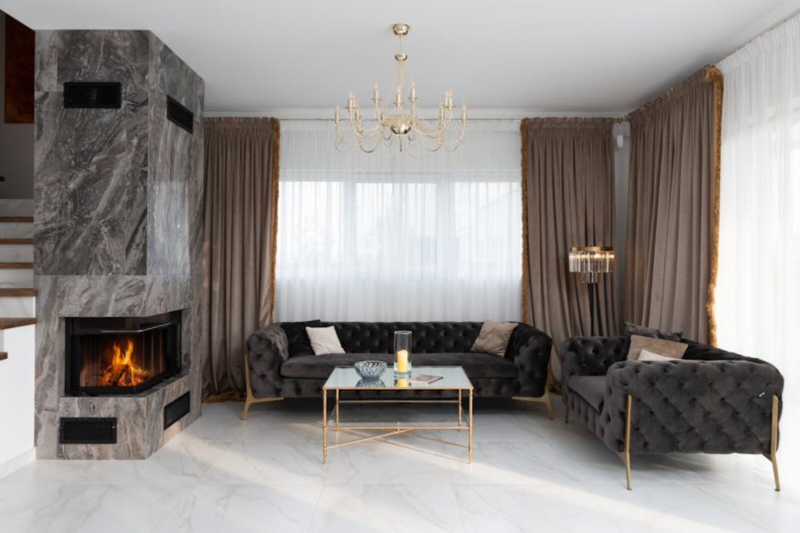 Elegant renovated living room with marble fireplace
