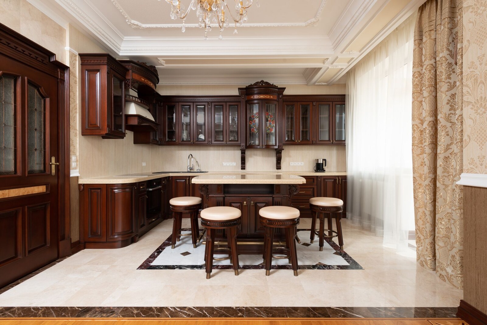 Luxury remodeled kitchen with dark wood cabinetry and island